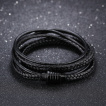 Bracelet homme style �crou � tresses et lani�res de cuir noir
