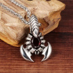 Pendentif scorpion inox � pierre rouge