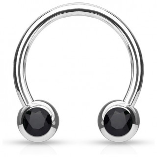 Piercing fer � cheval en acier serti deux cristaux noirs