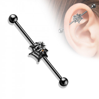 Piercing industriel noir � araign�e sertie sur sa toile